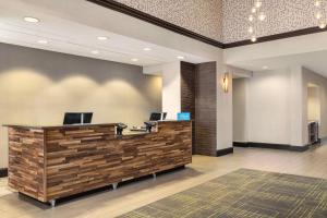 an office lobby with a reception desk with two computers at Hampton by Hilton Shelton in Shelton