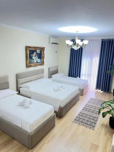 Postel nebo postele na pokoji v ubytování Kasmi Home 2