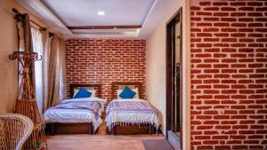 Letto o letti in una camera di Hong Si Hotel- A Home Away from Home