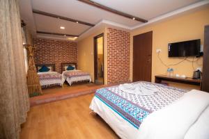 Letto o letti in una camera di Hong Si Hotel- A Home Away from Home