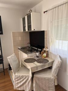 Η κουζίνα ή μικρή κουζίνα στο Delux Apartments Vele