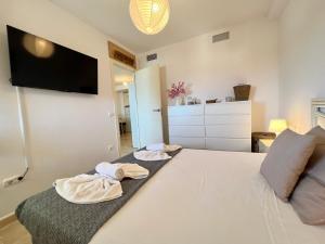 Postel nebo postele na pokoji v ubytování Apartamento Esmeralda Suites