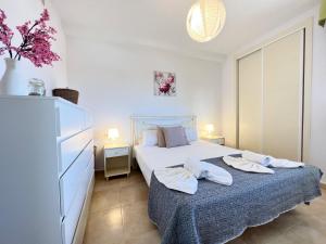Postel nebo postele na pokoji v ubytování Apartamento Esmeralda Suites