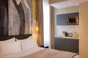 Ліжко або ліжка в номері Palais Ségurane Boutique Hôtel