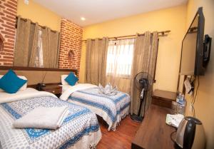 TV o dispositivi per l'intrattenimento presso Hong Si Hotel- A Home Away from Home