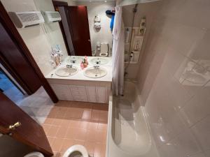 a bathroom with two sinks and a shower at Casa sevilla Cavaleri in Mairena del Aljarafe +27 photos