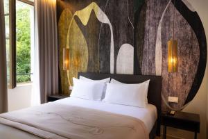 Ліжко або ліжка в номері Palais Ségurane Boutique Hôtel