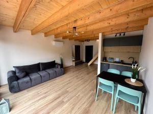 a living room with a couch and a table at Święty Spokój in Żeromin