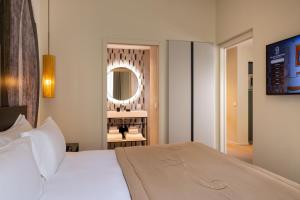 Ліжко або ліжка в номері Palais Ségurane Boutique Hôtel