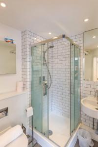 a bathroom with a glass shower and a sink at Pass the Keys Executive Penthouse 2 Bed Jewellery Quarter in Birmingham