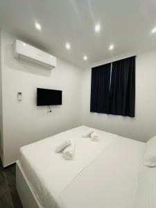 Posteľ alebo postele v izbe v ubytovaní Vila Zrina - Apartmani