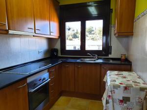 A kitchen or kitchenette at 5594 Apartment in Llançà