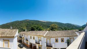 a group of houses with mountains in the background at Casa Pedro in Benaoján