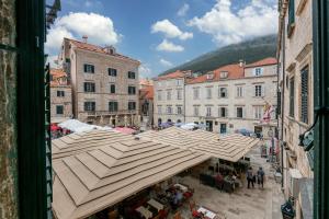 an overhead view of a market with umbrellas in a city at Clouds Boutique Guesthouse in Dubrovnik