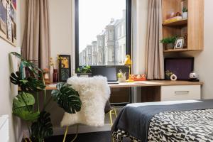 a bedroom with a desk and a bed and a window at Unite Students - Chalmers Street - The Meadows in Edinburgh