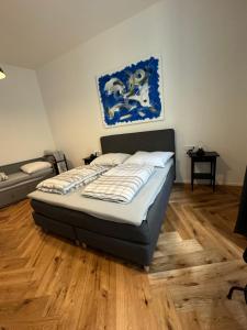 A bed or beds in a room at Industrial Apartment Schlossberg