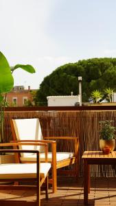 a pair of chairs and a table on a balcony at Binario9 in Lecce