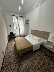 Postel nebo postele na pokoji v ubytování B&B Madama Teresa