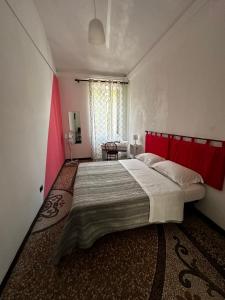 Postel nebo postele na pokoji v ubytování B&B Madama Teresa