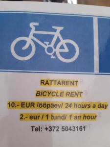 a blue sign with a bike on it at Mosina Vesiveski in Vissi