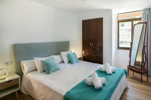 Postel nebo postele na pokoji v ubytování Nogalera Party&beach Select + 36 fotografií