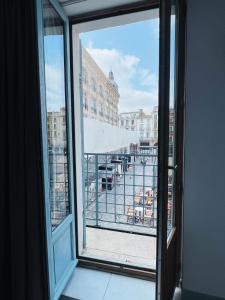 an open window with a view of a balcony at Domus Via Domitia in Narbonne