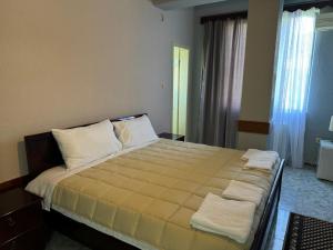 Postelja oz. postelje v sobi nastanitve SIRENA HOTEL