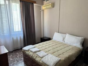 Postelja oz. postelje v sobi nastanitve SIRENA HOTEL