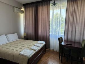 Postelja oz. postelje v sobi nastanitve SIRENA HOTEL
