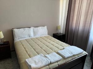 Postelja oz. postelje v sobi nastanitve SIRENA HOTEL