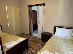 Postelja oz. postelje v sobi nastanitve SIRENA HOTEL
