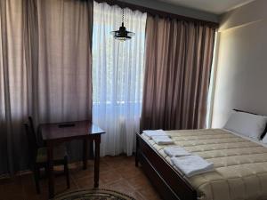 Postelja oz. postelje v sobi nastanitve SIRENA HOTEL