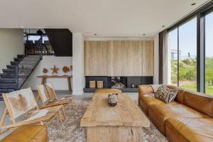 a living room with a couch and a table at Lake House with dock at Lake Veere, Zeeland in Arnemuiden