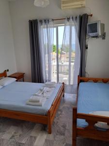 Postel nebo postele na pokoji v ubytování Golden Beach Sea View