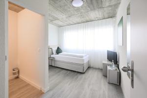Postel nebo postele na pokoji v ubytování Aabach Hotel