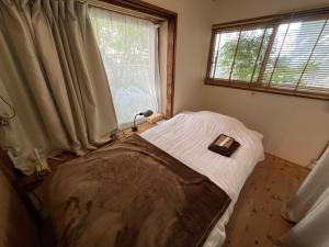 Letto o letti in una camera di コトのアート研究所