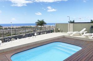 a swimming pool on the roof of a house at Harmony - Beach & Dream rentals in Playa de las Americas