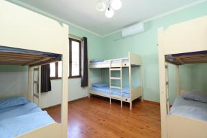 Postel nebo postele na pokoji v ubytování Hostel Osho