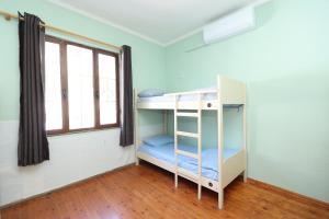 Postel nebo postele na pokoji v ubytování Hostel Osho