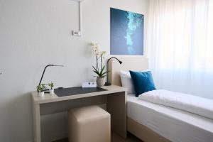 Postel nebo postele na pokoji v ubytování Aabach Hotel