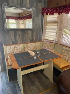 a dining room table and chairs with a table at Tummel 2 in Forfar +3 photos