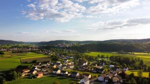 an aerial view of a small village in the hills at Naab Chalet 13 in Nabburg +2 photos