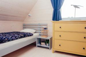 Postel nebo postele na pokoji v ubytování Fajne Miejsce Dębki