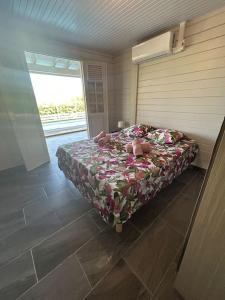 Postel nebo postele na pokoji v ubytování Nouveau ! Villa au Diamant + 10 fotografií