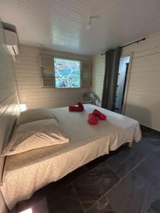 Postel nebo postele na pokoji v ubytování Nouveau ! Villa au Diamant