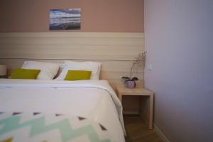Postel nebo postele na pokoji v ubytování 4Guest Hotel