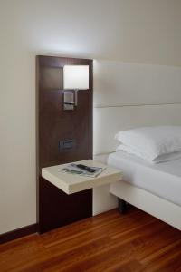 Postel nebo postele na pokoji v ubytování Kona Hotel Verona by Kleos Group Collection