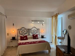Voodi või voodid majutusasutuse Piccolo Hotel Luisa toas