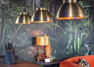 een kamer met drie lampen aan een muur bij The Bells - Luxury Serviced Apartments in Leeds