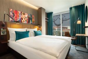 Katil atau katil-katil dalam bilik di Motel One Graz